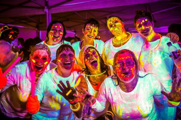 image of ladies covered in glow in the dark paint at neon netfit event